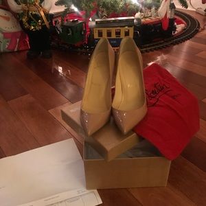 Christian louboutin tan stilettos.